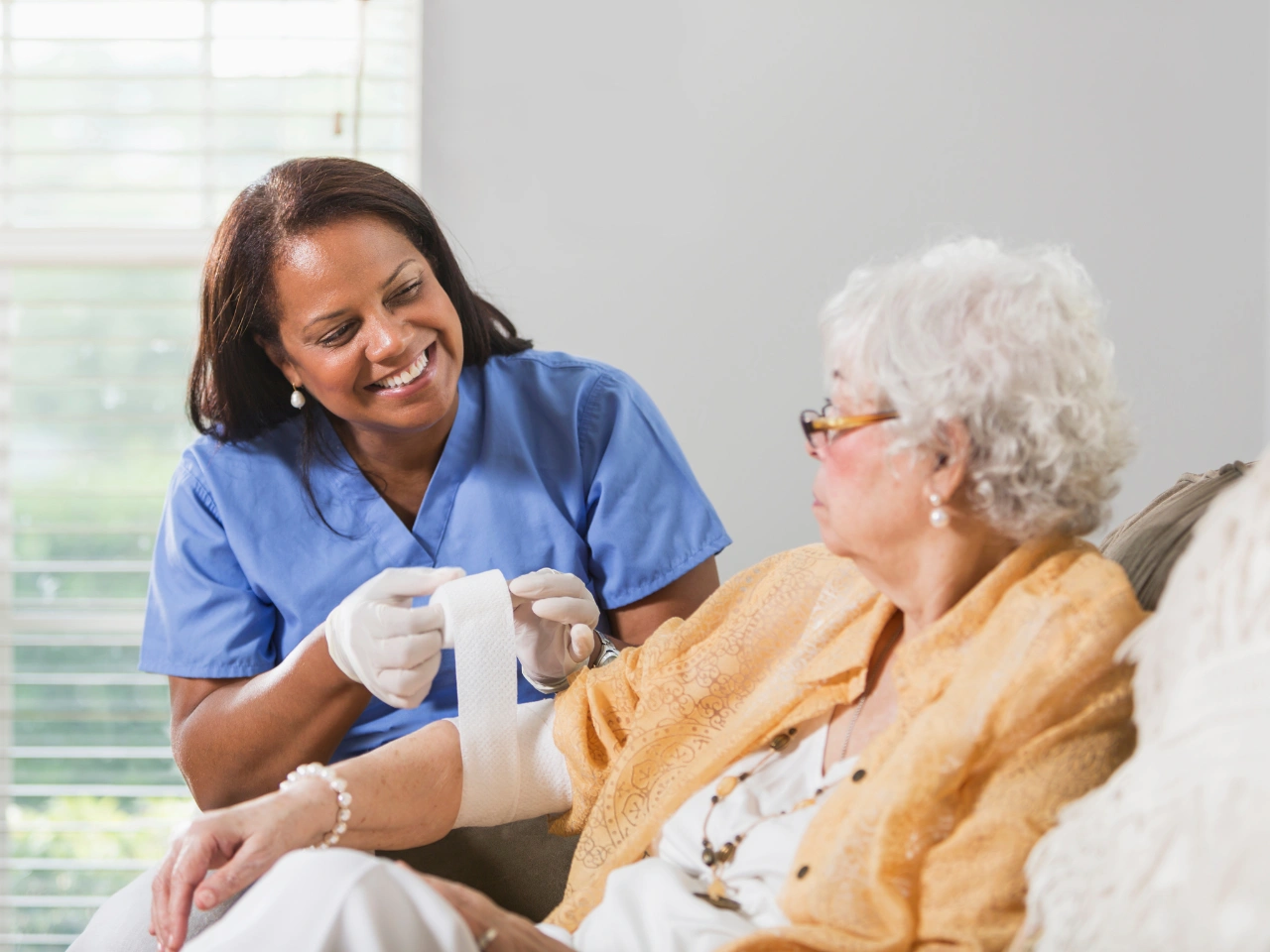 A healthcare professional providing specialized wound care treatment and recovery support for patients in Alexandria City, VA.