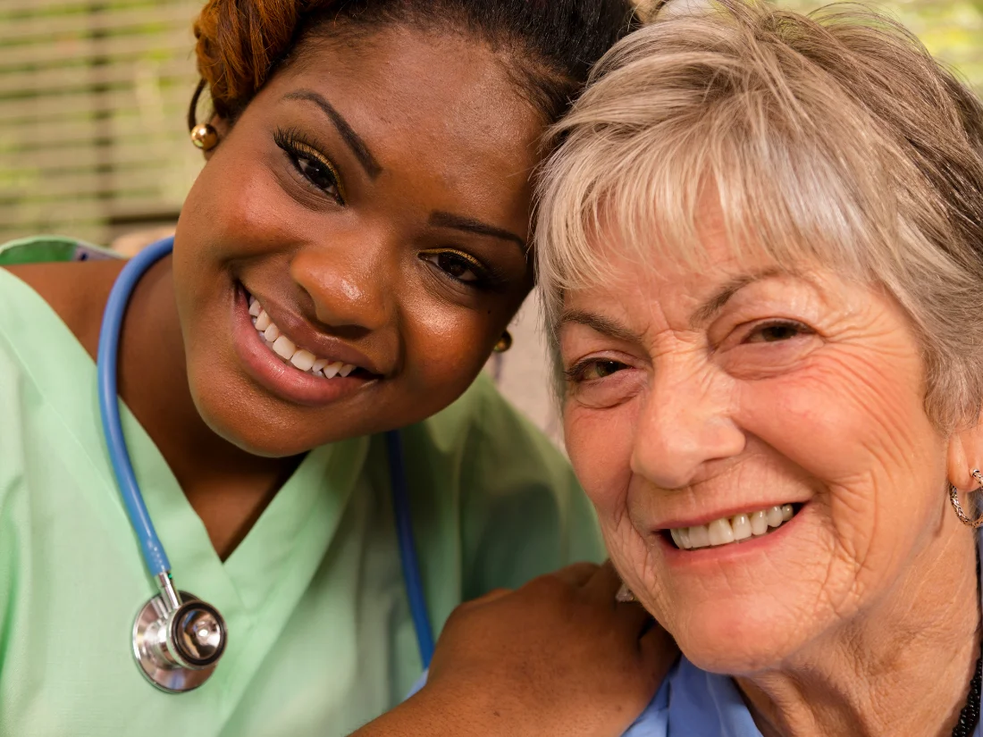 A smiling caregiver and senior representing compassionate, patient-centered home healthcare services in Alexandria City, VA.