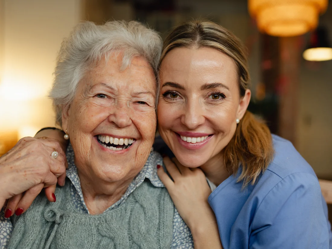 A dedicated caregiver sharing a warm moment with a senior while providing trusted home health care services in Alexandria City, VA.