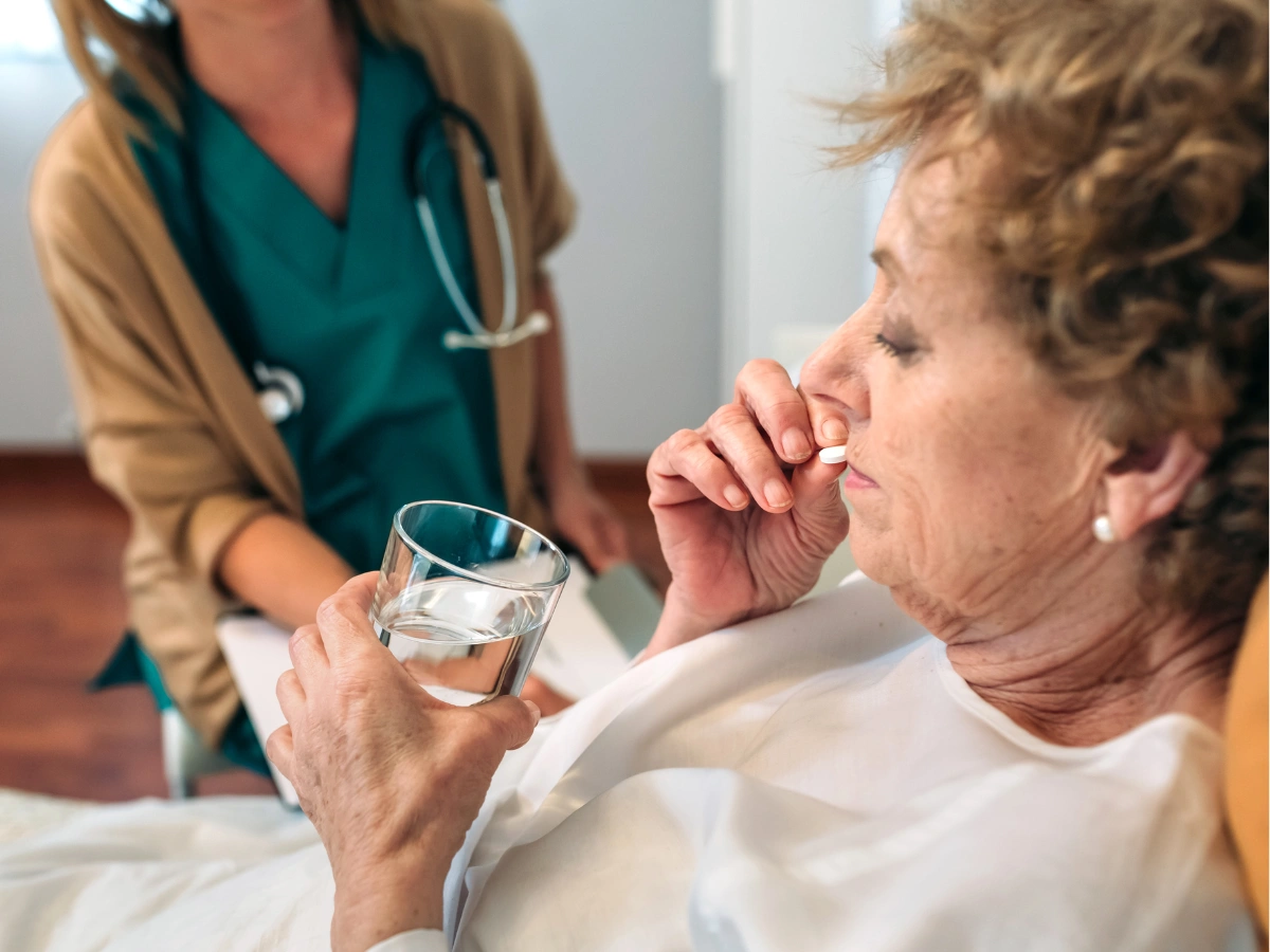 A skilled nurse providing compassionate bedside care and medical assistance to a patient in Alexandria City, VA.